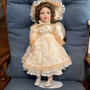 Menie porcelain doll with stand